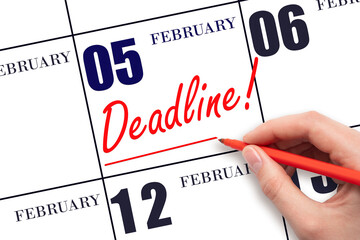 Hand drawing red line and writing the text Deadline on calendar date February 5. Deadline word...
