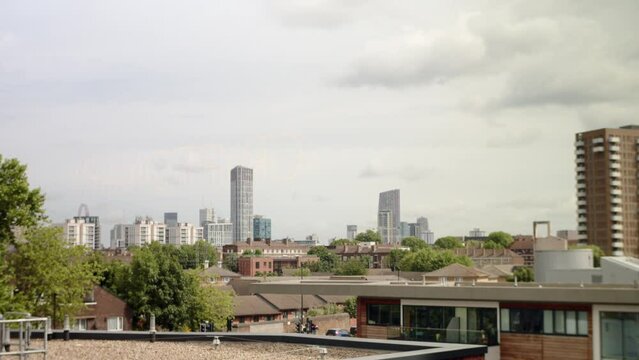 East London skyline with modern skyscrapers. Panorama panning left