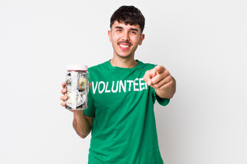hispanic volunteer pointing at camera choosing you. donations concept