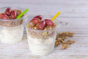 Bowl of fresh natural homemade yogurt with cereal served for good health.