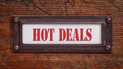 hot deals - a label on grunge wooden file cabinet, business marketing concept