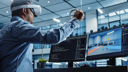 Automotive Engineer Using a VR Software to Work on Electric Motor and Vehicle Platform in Interactive Environment in a Factory Office. Industrial Engineer Using Headset and Controllers.