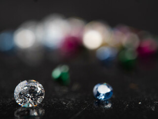 Close up shot of group multi colors diamond on a black background