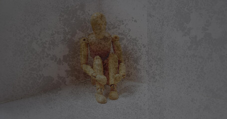 Textured scratched overlay against stressed wooden figurine with copy space on grey background
