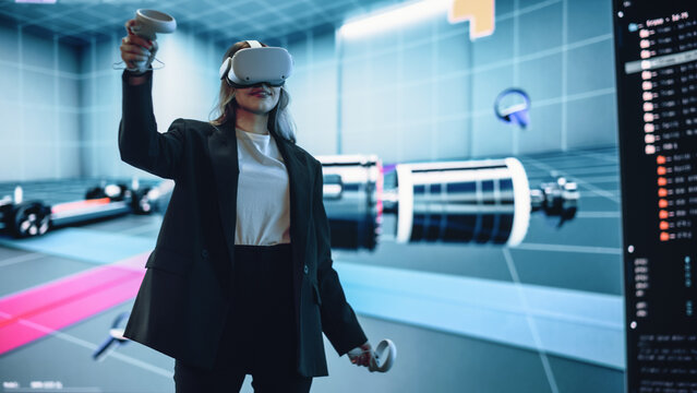 Automotive Engineer Making Presentation of a Modern VR Software Testing and Developing Vehicle Platforms. Engineer Uses Headset and Controllers to Showcase Functionality on a Big Screen on Stage. - Powered by Adobe