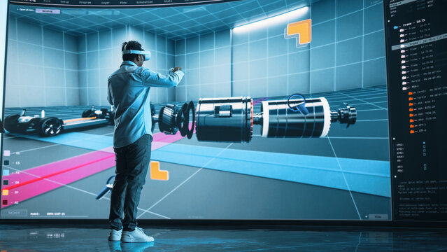 Automotive Engineer Making Presentation of a Modern VR Software Testing and Developing Vehicle Platforms. Engineer Uses Headset and Controllers to Showcase Functionality on a Big Screen on Stage.