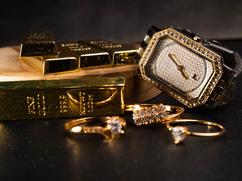 Picture of luxury woman wrist watch. Thus watch on a gold color and silver dial