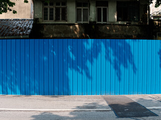 Blue iron sheet wall on street, close up view, this is very common in Shanghai lockdown time for Covid-19 coronavirus omicron quarantine policy.