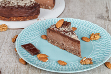A piece of chocolate pie on a blue plate