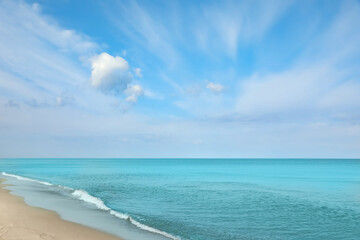 Beautiful view of sea shore and blue sky on sunny day