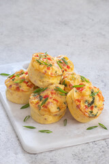 Delicious egg muffins with ham, cheese and vegetables