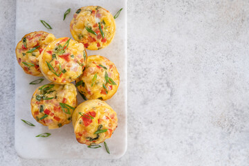 Delicious egg muffins with ham, cheese and vegetables