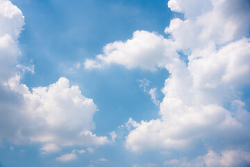 Naklejka na ściany i meble White clouds on blue sky in sunny day