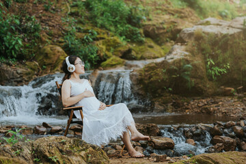 girl sitting on her stomach listening to music in the forest