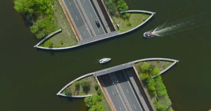 Small boat passing over Aquaduct Veluwemeer water bridge.