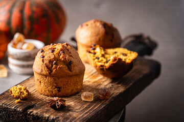 Homemade autumn pumpkin muffins with cinnamon and chocolate