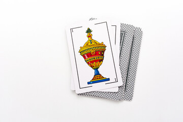 Spanish card game, spanish deck Tarot cards, the cups card in the foreground.