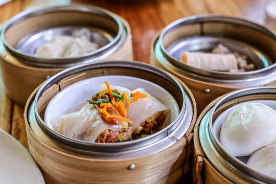 Asian food dim sum in bamboo steamer.