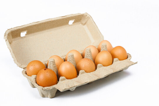 Eggs in a paper tray with white background
