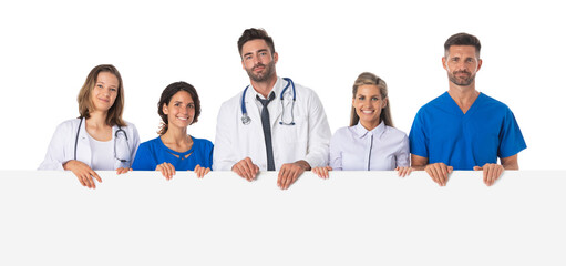 Medical team holding blank billboard
