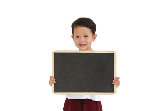 Adorable Asian little boy holding blank blackboard isolated on white background. Education concept.