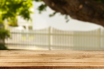 wooden table in front of blur landscape. Product display and presentation