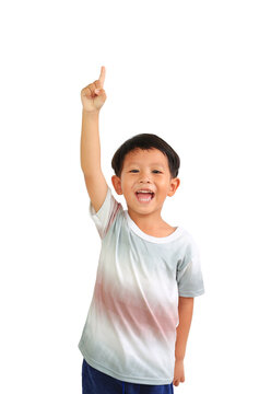 Smiling Asian little boy age about 5 years old raise hand and point one forefinger up with looking camera on white background.