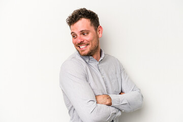 Young caucasian man isolated on white background laughing and having fun.