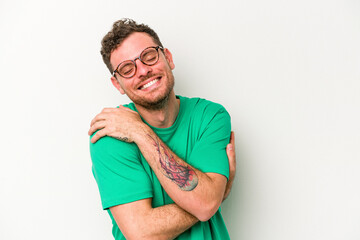 Obraz premium Young caucasian man isolated on white background laughing and having fun.