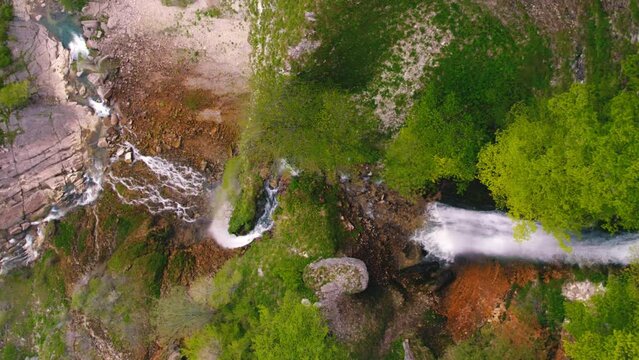 birds eye shot of Kinchkha waterfall and river on Okatse Canyon, vertical aerial video. High quality 4k footage