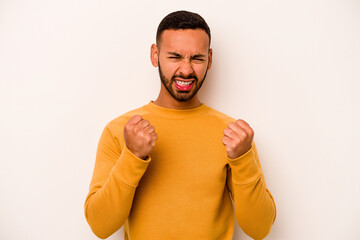 Young hispanic man isolated on white background upset screaming with tense hands.