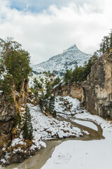 Mountain river with snow