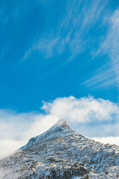 Mountain peak with clouds and snow