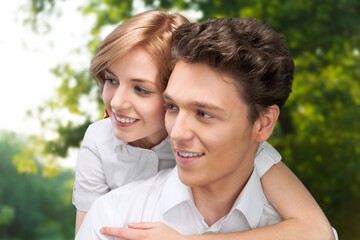 Obraz premium Portrait of an affectionate couple sitting on a pier out on a lake background