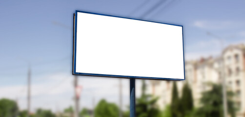 Horizontal billboard advertising mockup on a blurred background of the city