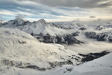 Fototapeta na wymiar Mountain winter landscape above clouds