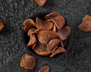 Garlic dark bread crisps, finger party food, beer snack