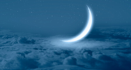 Ramadan Concept - Abstract background with Crescent moon over the sunset clouds
