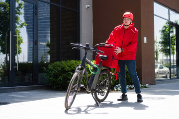 Courier on bicycle with parcel, bike delivery service