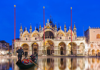 San Marco's Basilica - San Marco square with Campanile - Venetian gondolier punting gondola -...