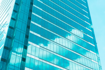 underside panoramic and perspective view to steel blue glass high rise building skyscrapers