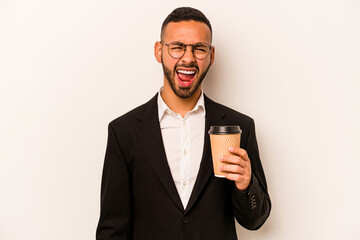 Young business hispanic man holding takeaway coffee isolated on white background screaming very angry and aggressive.