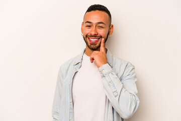 Young hispanic man isolated on white background smiling happy and confident, touching chin with hand.