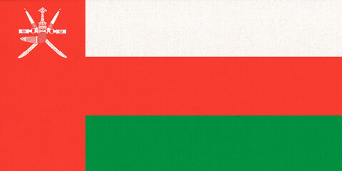 Flag of Sultanate of Oman. Fabric Texture. National symbol.