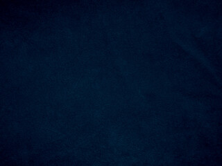 Dark blue old velvet fabric texture used as background. Empty blue fabric background of soft and smooth textile material. There is space for text.