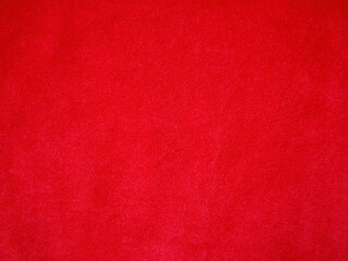 Red velvet fabric texture used as background. Empty red fabric background of soft and smooth...