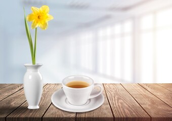 Flowers and tea cup served for breakfast, valentine's day, wedding or anniversary morning decorations.