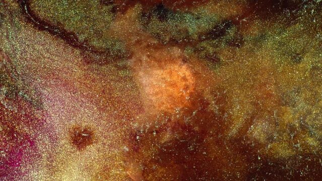 Shiny gold and copper metallic particles macro. Space cosmos universe nebula background