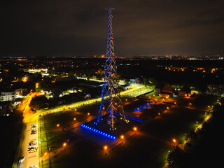 Radio station in Gliwice on night. The largest wooden tower in the world. The historic tower in Gliwice, aerial view.