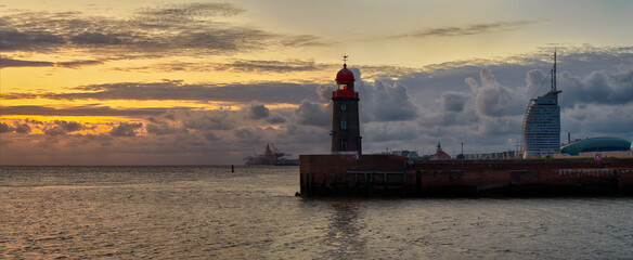 scenic sunset panorama over the lighthouse Geestemole Nord in Bremerhaven, Germany